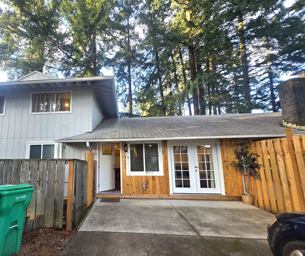 The AddisCare home at 17203 NE Pacific St., Northeast Portland, framed by tall evergreens